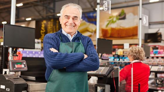 Older gentleman working in a grocery store