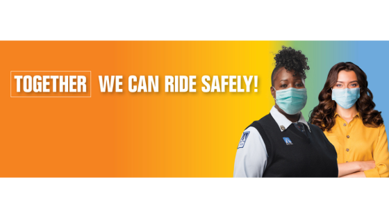 Orange County Transit Authority bus driver wearing a mask, standing next to a client also wearing a mask