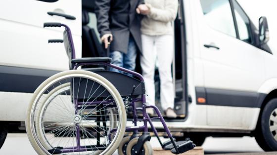 Nurse Helping Senior Man Exit A Van